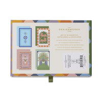 Set of assorted notecards and envelopes with colorful designs on a white background